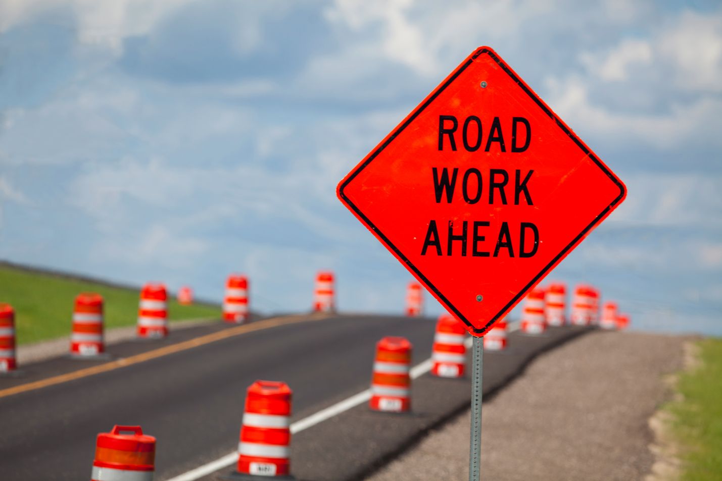photo of Road Work Ahead sign and cones