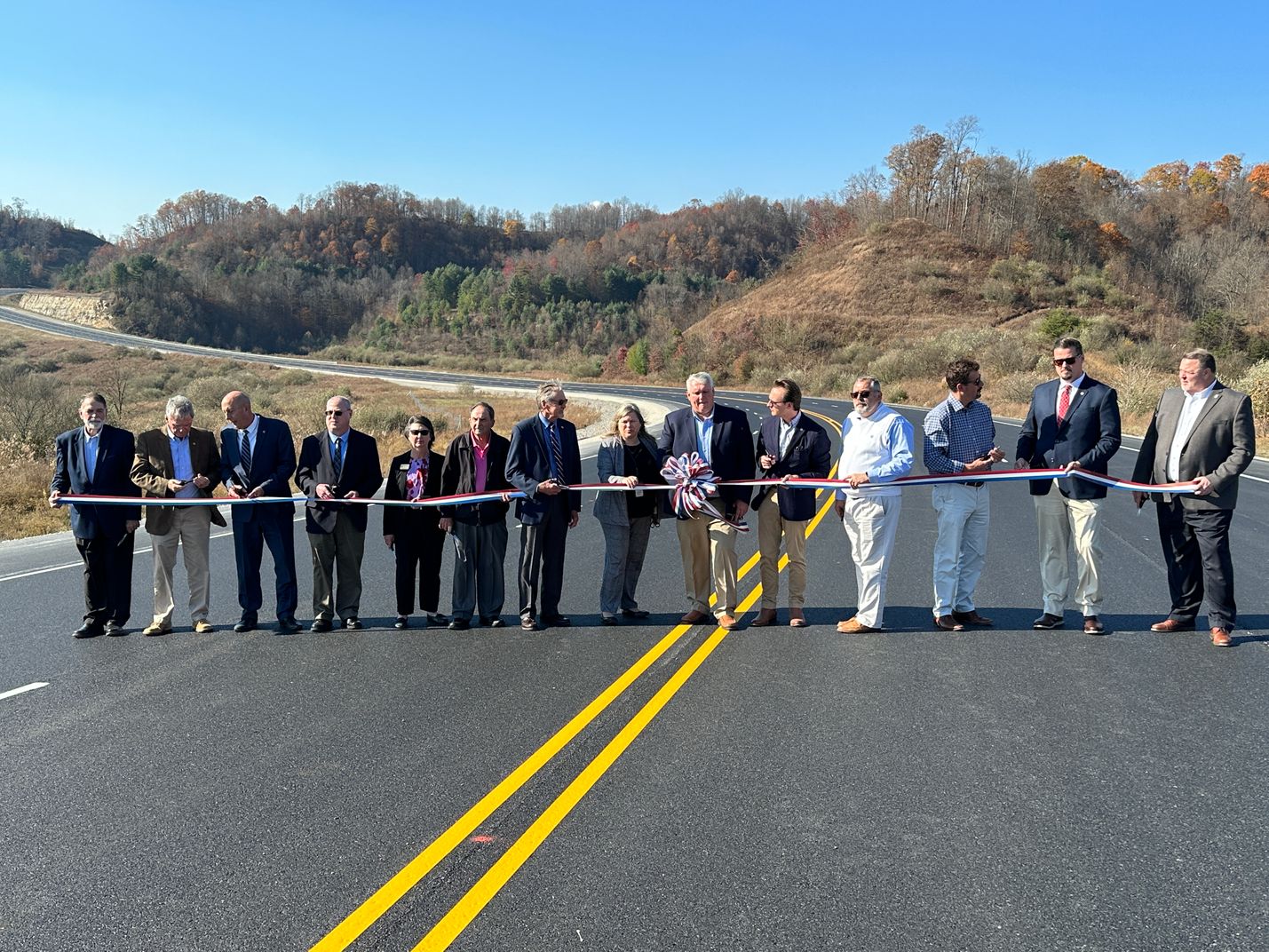 ribbon cutting ceremony along 460/121 for a new eight-mile stretch of road