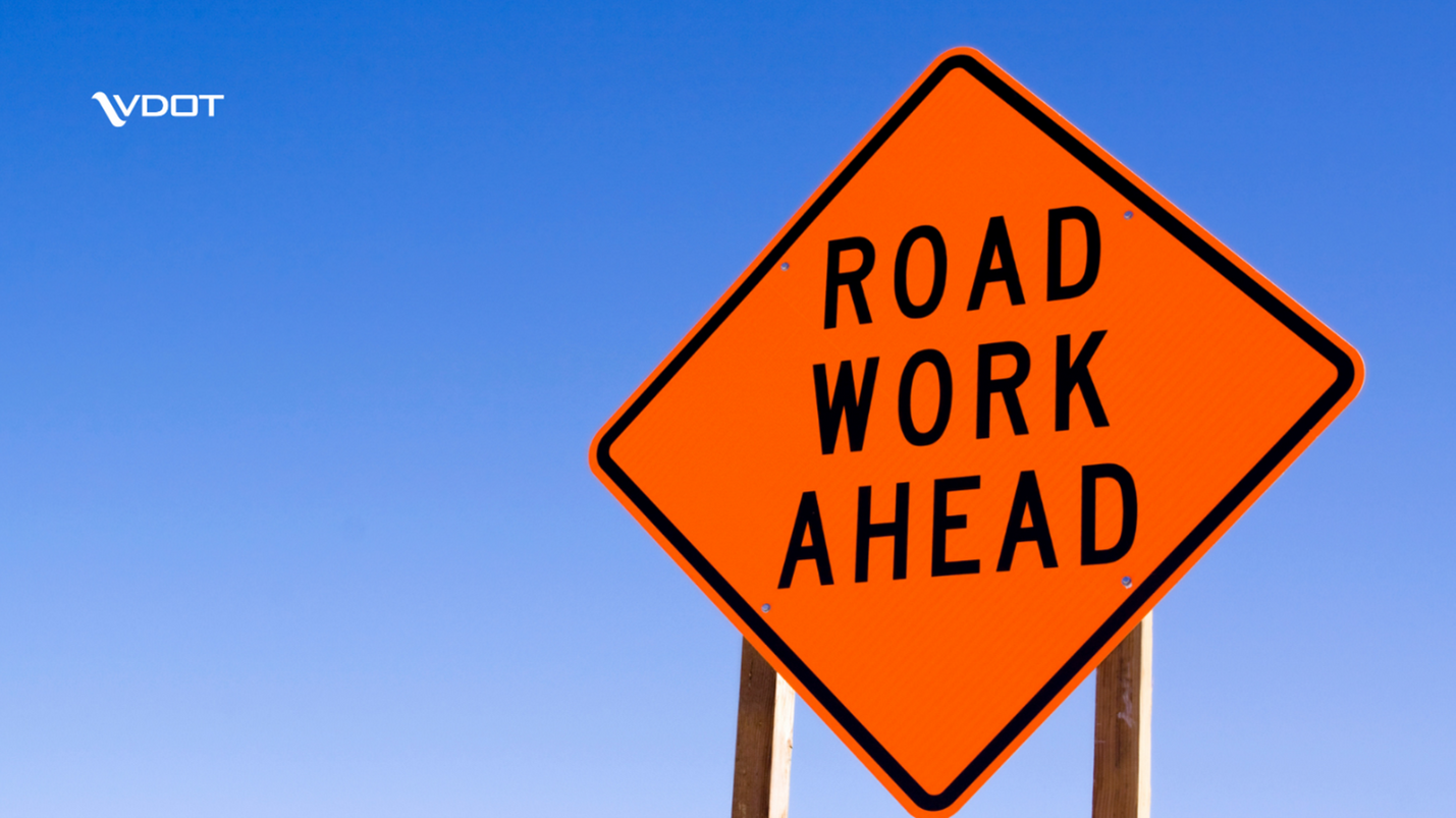 Sign that reads road work ahead