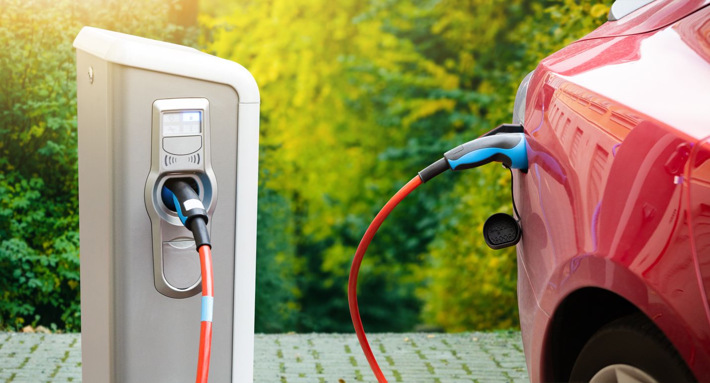 A car charging at a charging station