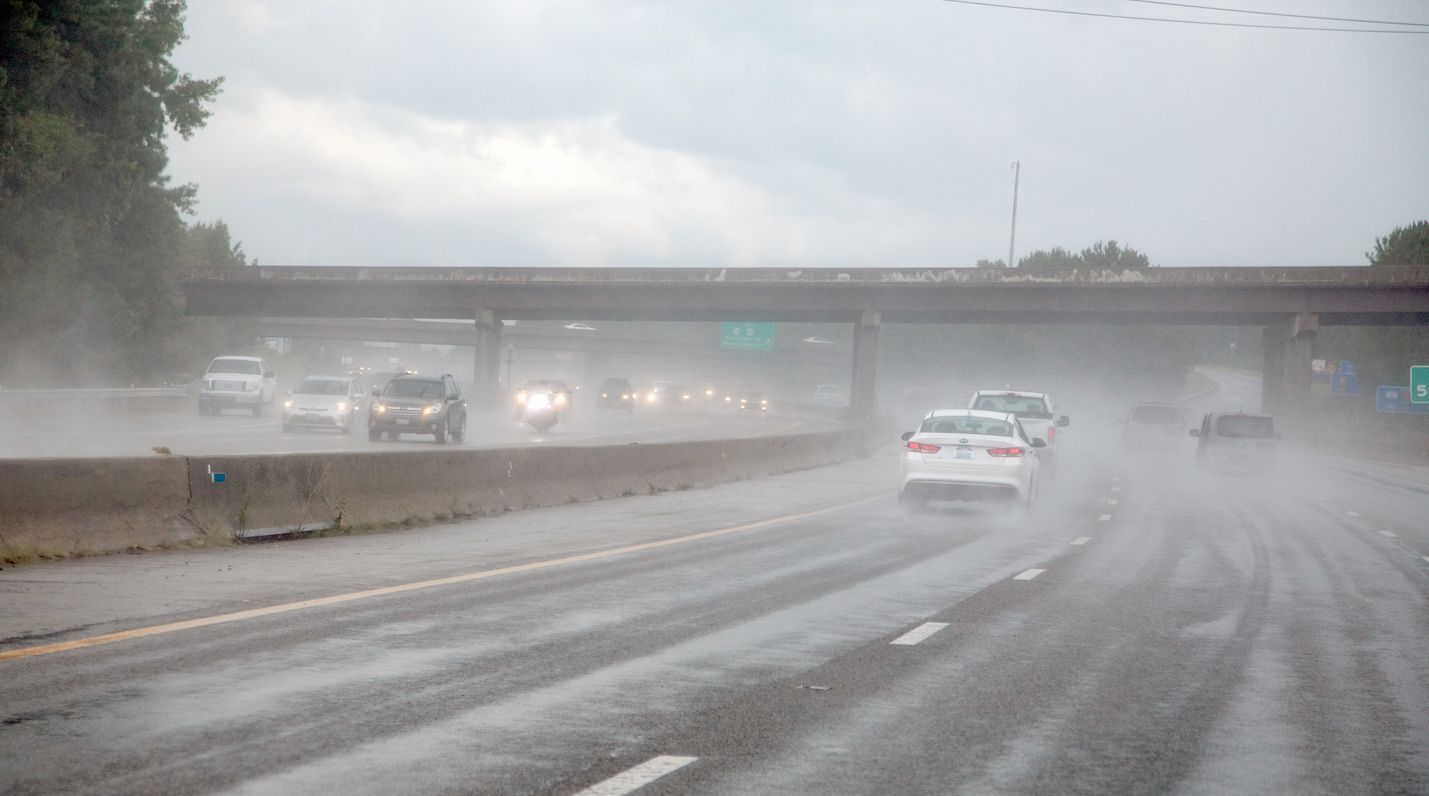 Cars driving on wet pavement