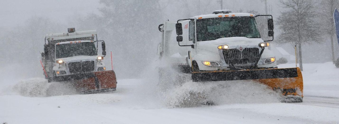 Snow plows clearing snow