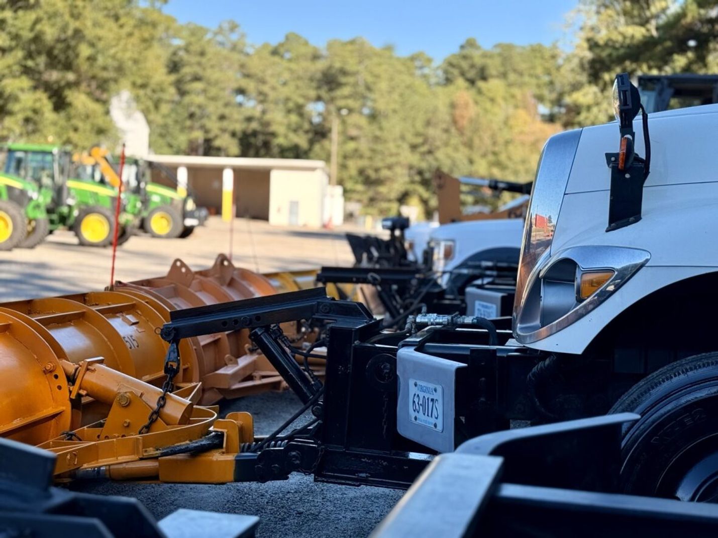 Close up of snowplows parked close together
