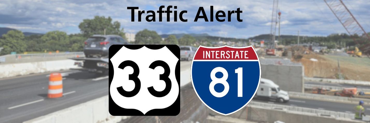 Photo of bridge work at the junction of two multi-lane roadways, with traffic and construction equipment visible. Overlaid is the text Traffic Alert and the Route 33 and I-81 shields