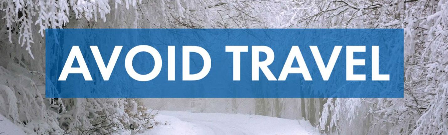 The words Avoid Travel imposed on a picture of a snowy road