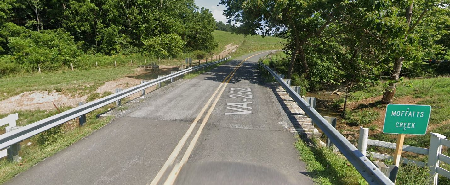 Google Streetview screencap of two-lane bridge over small creek