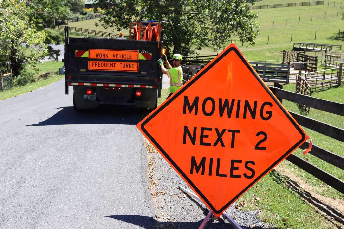 Mowing Next Two Miles Sign