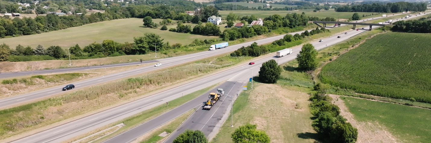 Aerial view of rest area ramps and adjacent overpass bridge
