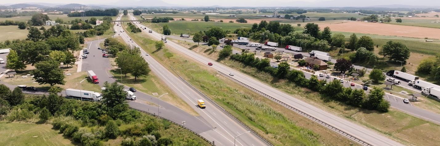 Aerial view of Mount Sidney Safety Rest Areas along I-81 in Augusta County. In the background is a bridge over the interstate.