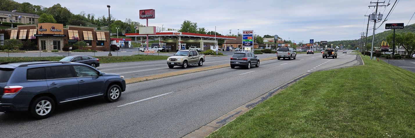 Traffic on Route 11 with numerous businesses along roadway