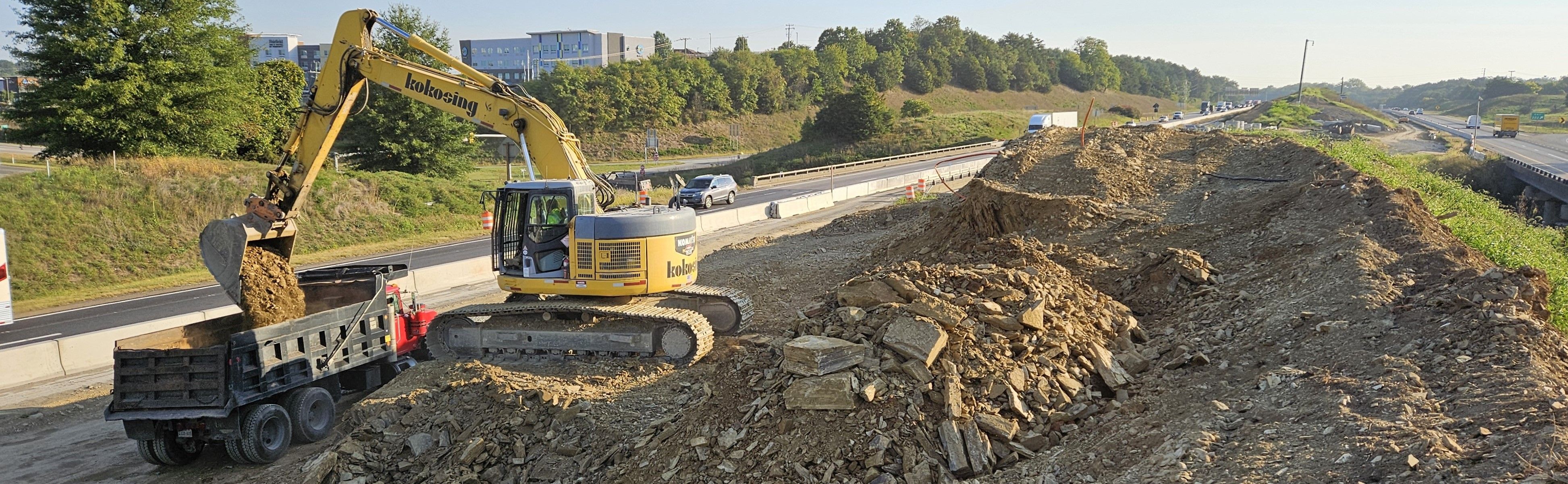 Construction equipment in the median between interstate lanes