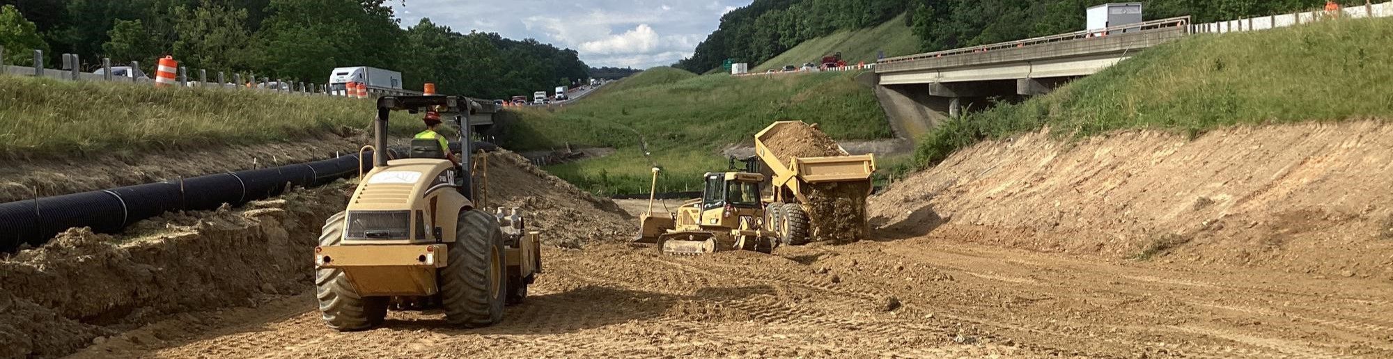 Heavy equipment moving earth in the median of Interstate 81 in the Staunton area