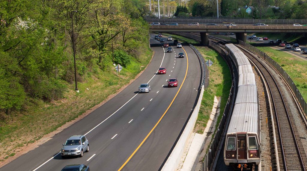 photo of 66 express lanes with cars and train